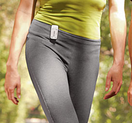 woman wearing activity link monitor while walking
